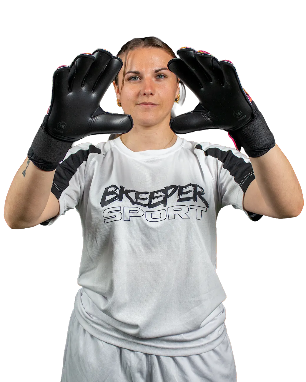 A woman wearing black goalkeeper gloves and a white goalkeeper jersey with 'BKEEPER SPORT' printed on the chest, posing with her hands raised against a solid white background.