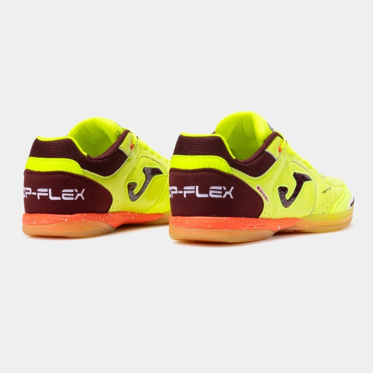 Pair of neon green and brown sports shoes with 'Joma' branding on a white background