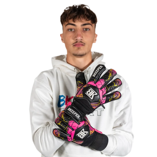 Person wearing colorful goalkeeper gloves with 'BK' branding on a white background