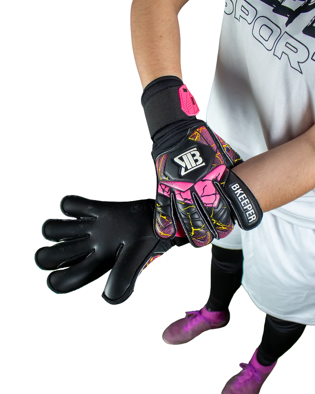 A pair of soccer goalkeeper gloves, one worn on a hand and the other displayed flat, featuring a black base with vibrant pink, yellow, and blue graphic patterns. The gloves have a white and black 'XB' logo on the back of the hand and 'BREEFER' printed on the wrist strap.
